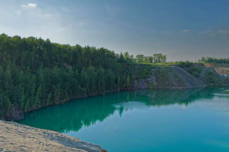 Landscape with lake, forest, mountain and blue skyの写真素材