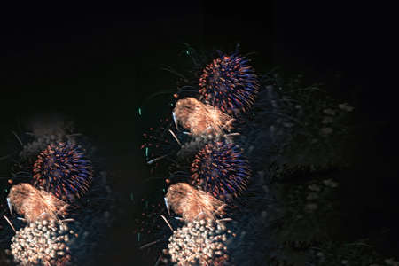 Brightly colorful fireworks and salute of various colors in the night sky