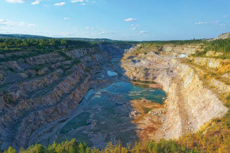 A large old quarry for dolomite mining flooded with groundwater from above