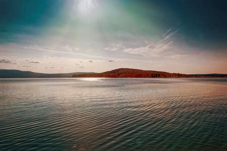 Beautiful summer landscape on the shore of a mountain lakeの写真素材