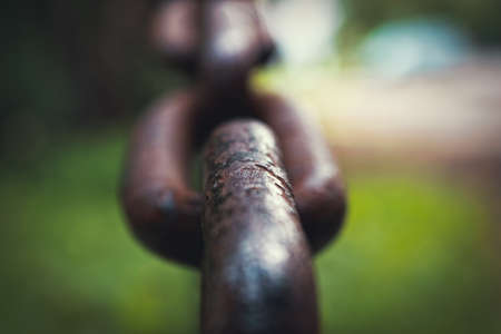 Thick steel chain on blurred backgroundの写真素材