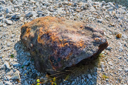 iron ore lies on the surface of the earth near a deposit in the Ural mountainsの写真素材