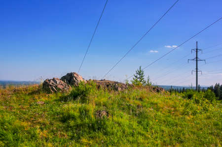 Summer landscape view of the forest and mountain range from the top of the mountain on a warm sunny day.の写真素材