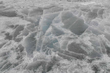 Melting ice. Texture of melted ice on the lake in spring.
