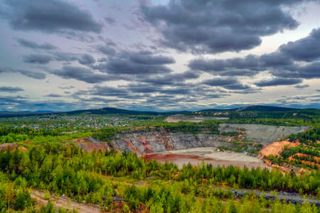 Top view of the large iron ore quarry Nizhny Tagil Russian Federation