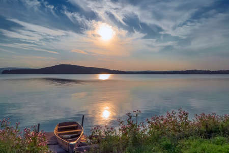 Summer landscape on the shore of a mountain lakeの写真素材