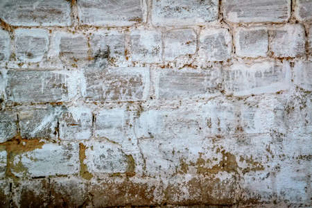 Texture of the old wall with peeling paint, plaster with cracks.