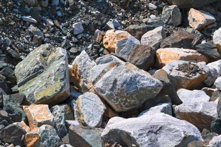 Natural texture of stones of large and small size. Danger of rockfalls. Rocks broken into pieces of...