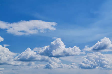Blue summer sky white cumulus clouds background.
