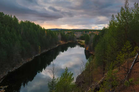 Autumn lake shore sunset landscape. Autumn sunset lake view.の写真素材