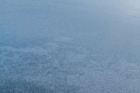 Texture of ice covered with hoarfrost. Background with frozen surface covered by frost.の写真素材