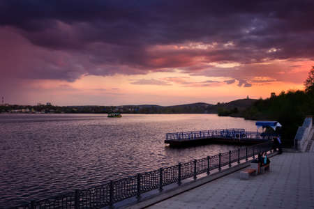 City evening. Sunset. Colorful sky and clouds. Summer city landscape.の写真素材
