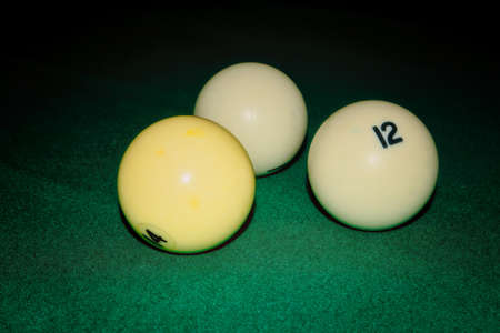 Billiard table close up. Playing billiard. Billiards balls on green billiards table.