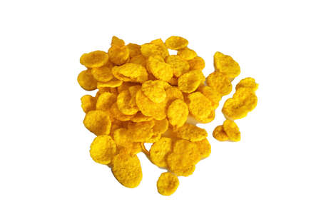 Corn flake cereal in a pile isolated against a white background.