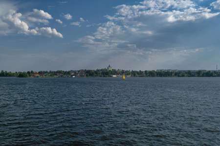 A wonderful summer landscape overlooking the embankment of sity pond Nizhny Tagil, Russia.