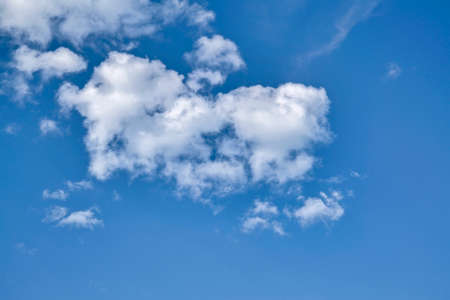 Blue sky with cumulus clouds. Cumulus clouds in the blue sky. Beautiful clouds in the blue sky background.の写真素材