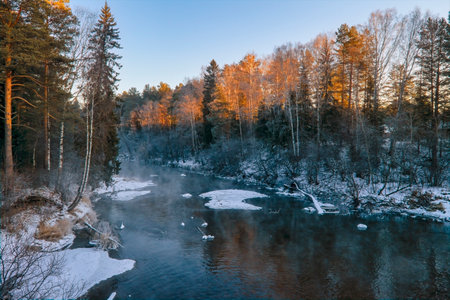 Evening on the river. Beautiful winter landscape. Scenic view of a river in winter.の写真素材