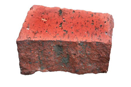 Chunk of red brick isolate on a white background close-up. Old red brick isolated on white background.の写真素材