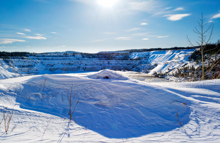 Winter landscape in the mountains on a sunny frosty day. Frosty day in snowy coniferous forest.