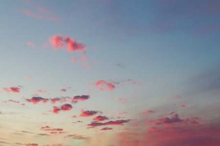 Evening sky in the picturesque clouds, lit by the rays of the setting sun.