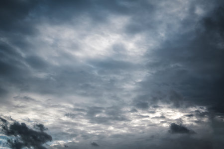 Beautiful real sundown sunset sky with beautiful light clouds and sun.の写真素材