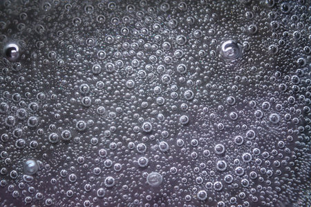 Water boiling texture. Water bubbles pattern. Fizzy water background. Air bubbles backdrop.