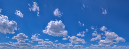 White cumulus clouds in blue sky beautiful cloud background. Panorama.