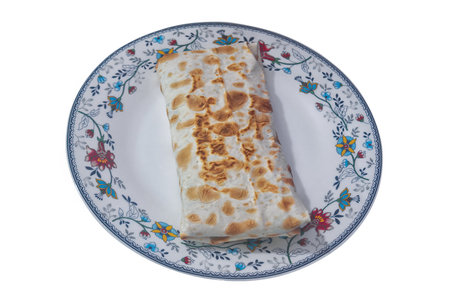 Appetizing shawarma with fried chicken meat and vegetables isolated on white background.の写真素材