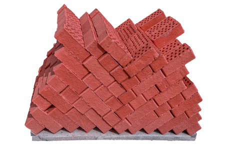 New red bricks on a pallet close-up isolate on a white background.の写真素材