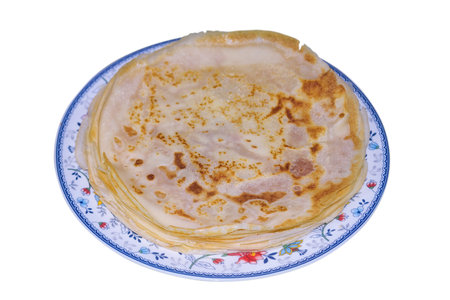Thick homemade pancakes on a plate. Freshly baked homemade cakes.