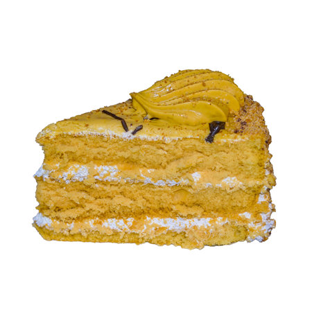 Piece of sponge cake with cream isolate on white background close-upの写真素材