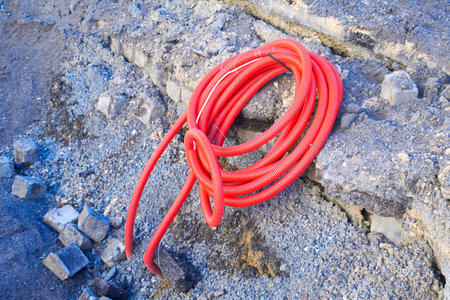 Red color PVC corrugated pipes for cable lay on the construction siteの写真素材