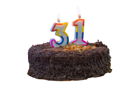 Birthday chocolate cake with a candle in the shape of the number 31 isolate on a white background.の写真素材