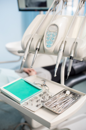 Different professional dental instruments in a dentist's officeの写真素材