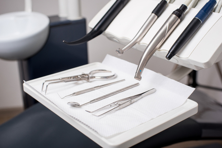 Different professional dental instruments in a dentist's officeの写真素材