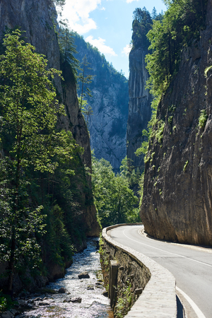 Stunning natural scenery Bicaz Canyon road Gorges on a sunny beautiful day copyspace sunlight weather climate Europe Romania travelling trip voyage weekend tourism.の写真素材