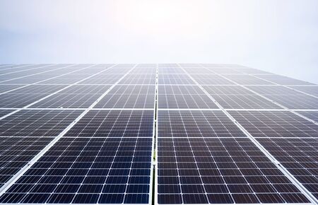 Solar power station. Close up. Source of environmental renewable energy. Photovoltaic power supply systems. Green energy concept design. Natural background.の写真素材