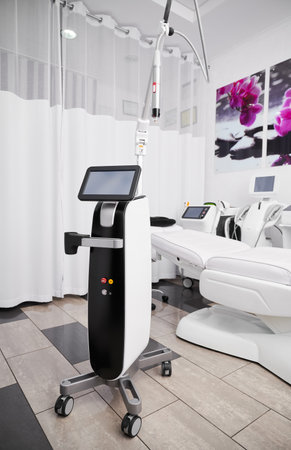 Cosmetologist cabinet with radiofrequency microneedling device for collagen induction therapy. Professional cosmetology equipment for skincare rejuvenation treatment in beautician office.の写真素材