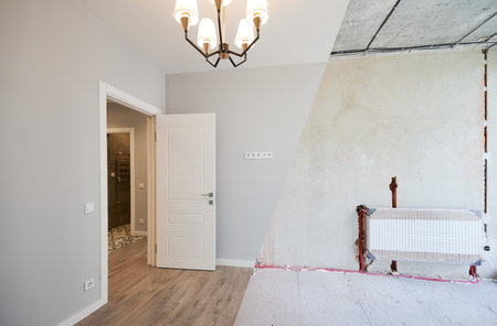 Photo collage of apartment room before and after restoration or refurbishment. Old room with doorway and new renovated living room with parquet floor and elegant interior design.の写真素材
