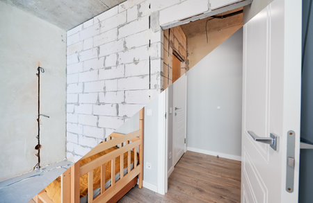 Comparison of children room with wooden bunk bed before and after restoration. Old apartment room with brick wall and new renovated flat with parquet floor and kid house bed.の写真素材