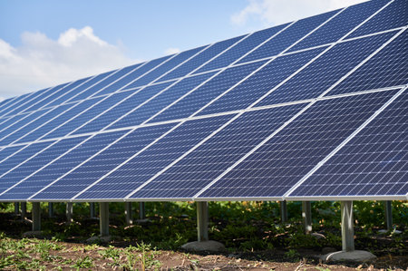 Solar system as modern lifestyle. Large photovoltaic panels working at sunny day. Saving nature with your own benefit.の写真素材