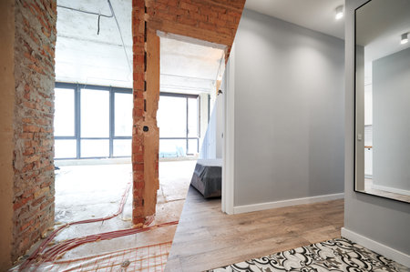 Living room and bedroom with large windows and doors before and after refurbishment or restoration. Old apartment before renovation and new renovated flat with parquet floor and furniture.の写真素材