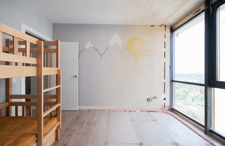 Old apartment room with brick wall and new renovated flat with parquet floor and kid house bed. Comparison of children room with wooden bunk bed before and after renovation.の写真素材