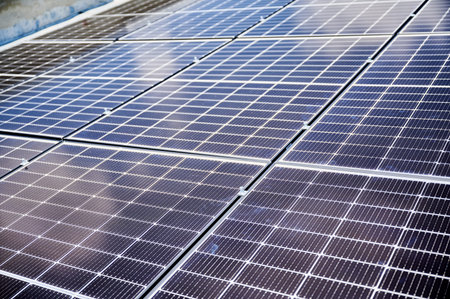Solar photovoltaic panels on rooftop. Close up of solar batteries installed on top of house. Concept...