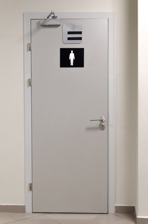 grey toilet doors for male genders in the airportの写真素材
