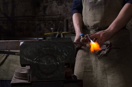 Craftman keep welding stuff in a handの写真素材