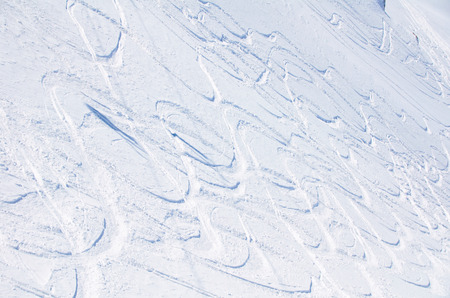 Freeride off-piste snowboard track in fresh white snow. Extreme sport concept of winter games.の写真素材