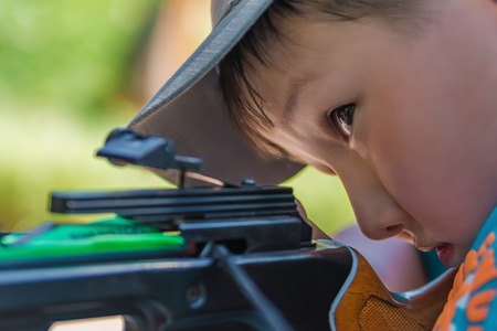 Portrait of little boy with the arbaletの写真素材