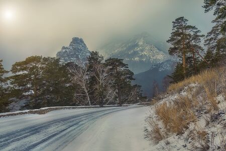 Winter road to the mountains. The landscapeの写真素材