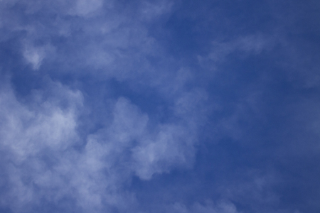blue sky with clouds overhead backgroundの写真素材